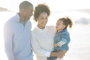 Portrait of happy family in sunlight