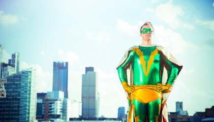 Superhero standing near city skyline