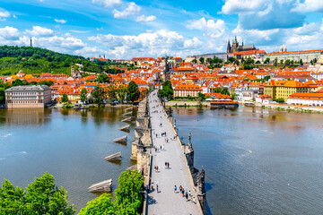 Prague panorama with Prague Castle, and Charles Bridge over Vltava River. View from Old Town Bridge Tower, Czech Republic.