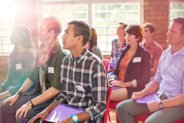 Attentive audience listening in community center