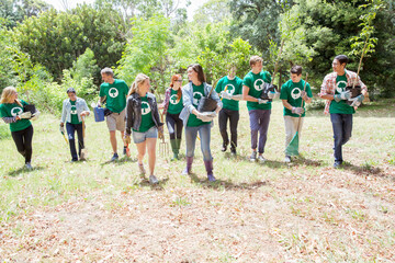 Environmentalist volunteers planting new tree