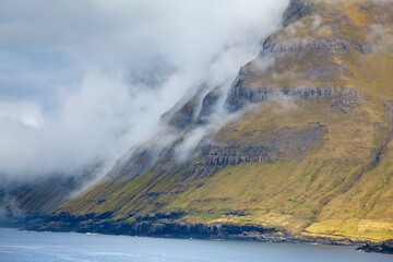 Clouds along cliffs, Funningur, Eysturoy, Faroe Islands