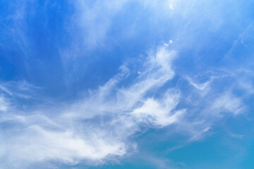Fluffy white cloud on blue sky.