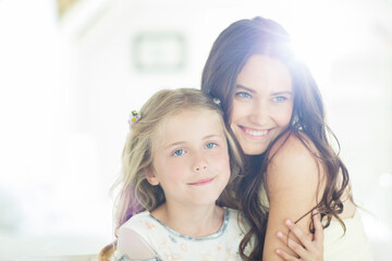 Portrait of bridesmaid and girl in domestic room