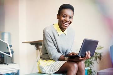 Portrait smiling businesswoman working with digital tablet
