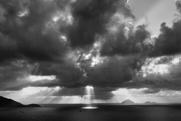 Landscape sunrise on Hon Chong cape, Nha Trang, Vietnam. Travel and nature concept. Morning sky, clouds, sun and sea water. Black and white
