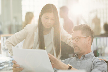 Fototapeta premium Business people discussing paperwork in office