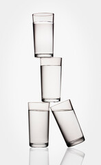 Stacked water glasses balancing