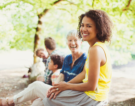 Portrait laughing multi-generation family in woods