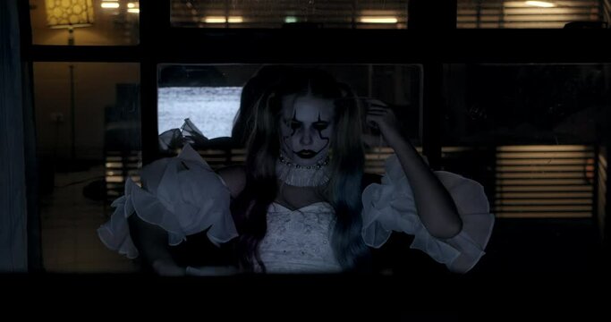 Short Clip of a Female Clown Playing With Her Hair