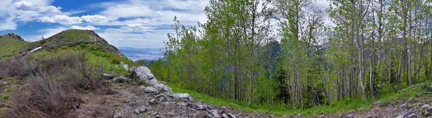 Rocky Mountain Wasatch Front peaks, panorama landscape view from Butterfield Canyon Oquirrh range toward Provo, Tooele Utah Lake by Rio Tinto Bingham Copper Mine, Great Salt Lake Valley in spring. Uta