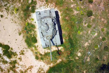 Aerial top view of a military tank .