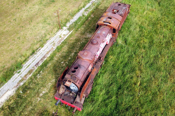 Old train cemetery. Aerial view of an old abandoned rusty steam train. High quality 4k footage