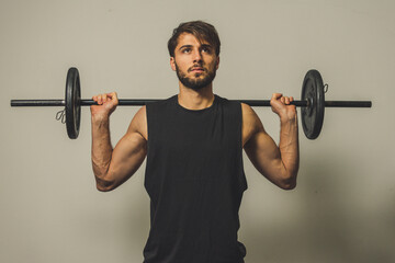 muscular man lifting weights