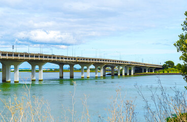 Landscape View to Mangere bridge over the Manukau Harbour, Motorway Bridge in South-Western Auckland New Zealand