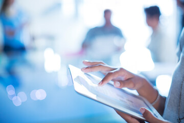 Close up businesswoman using digital tablet