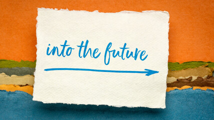 into the future - inspirational handwriting on a handmade rag paper against abstract landscape