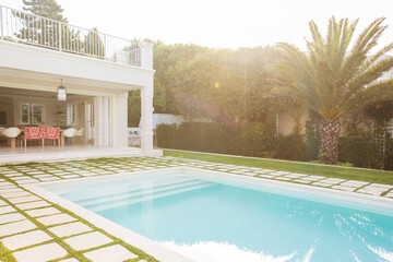 Luxury swimming pool surrounded by paver stones