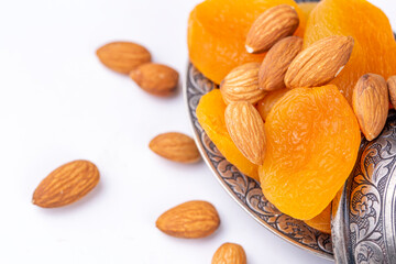 Dried apricot and almond on the white background