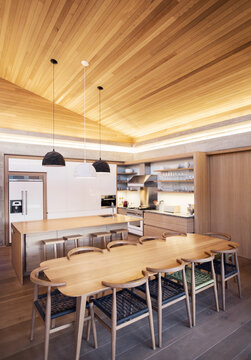 Illuminated Slanted Wood Ceiling Over Kitchen