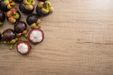 "The Queen of Fruits" Mangosteen ,a fruit from Thailand  and has been popular. on wood floor texture