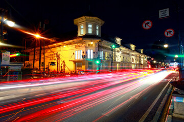 Jalan Asia Afrika in Bandung City, Indonesia at night with light trails.