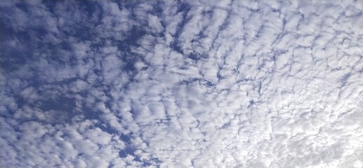 The morning sky, white clouds alternating with natural waves, obscures the blue background from Thailand.