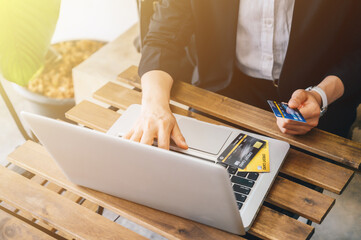 Businesswoman doing shopping online and payment by credit cards.