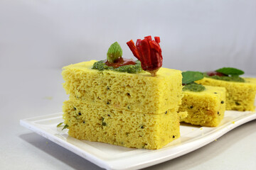 Khaman Dhokla is very popular  Steam cooked Gujarati snacks made from Bengal gram[Chana Dal] and served with chutney.
