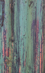 Old weathered corrugated sheet /panel with peeled paint. Background texture of rusty painted corrugated iron cladding