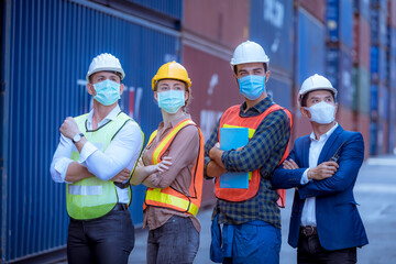 The worker used a medical Digital  temperature Thermometer to check staff body temperature before start work in factory ,they wearing face mask the concept of a corona virus [Covid-19] screening.