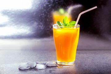 Fresh summer cold mango cocktail with lime  on the bar.