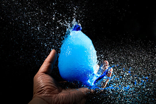 The moment the blue water and water balloon exploded