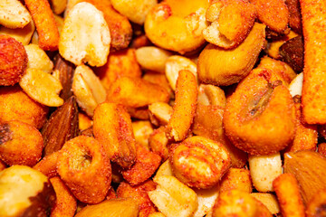A mixture of different nuts. Healthy food, fitness diet. Surface texture. Close up.
