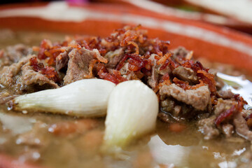 Delicous Mexican meal known as Carne en su jugo, which is a beef broth 