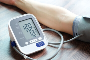 Man check blood pressure monitor and heart rate monitor with digital pressure gauge. Health care and Medical concept