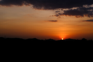 sunset light yellow gold sky evening with mountain