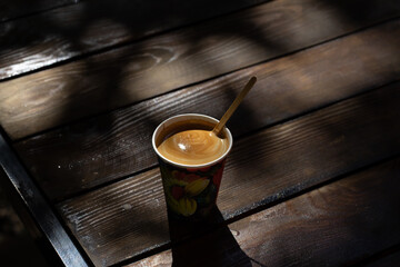 cup of coffee on wooden table