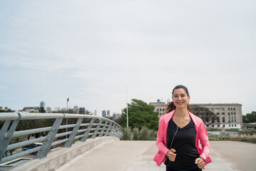Fototapeta na wymiar Portrait of fitness woman running.