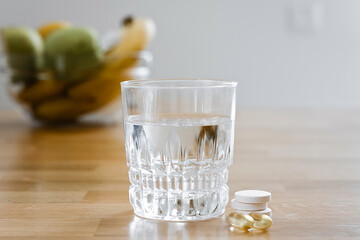 Close up glass with water and sparkling pill. Magnesium anti-stress, painkiller or orange drink