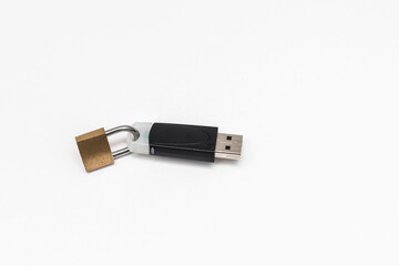 Closed padlock on a flash drive on a white background. Close-up. Information storage security...