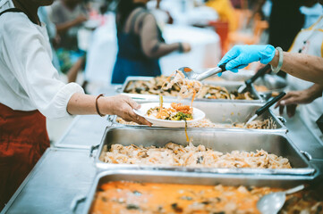 Homeless and needy people receive help, receive food from volunteers : concept of food donation