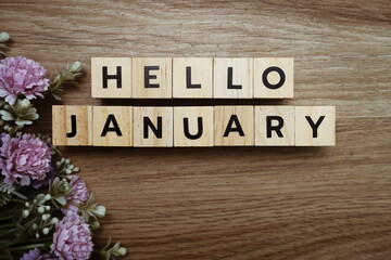 Hello January alphabet letters on wooden background