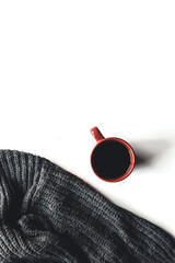 Autumn composition. Cup of coffee, sweater on white background. Autumn