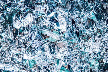 texture in silver and blue shades. folds of foil. wrapping paper. texture of crumpled silver...