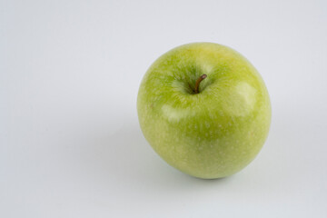 Red and green apple, half apple, bitten apple on a white background, seeds