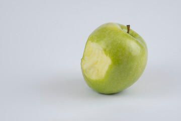 Red and green apple, half apple, bitten apple on a white background, seeds