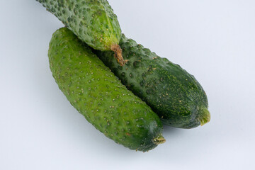 Organic cucumbers on a white background