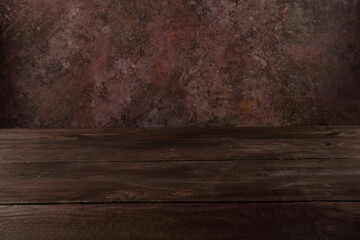 Image of wooden table in front of blurred background. Empty wooden table platform over background for present product.