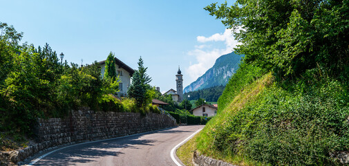 Naklejka na ściany i meble Typical mountain village landscape on the Italian dolomites. Trentino-Alto Adige region of South Tyrol, Italy.